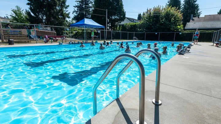 Hammond Outdoor Pool with handrails beside the water
